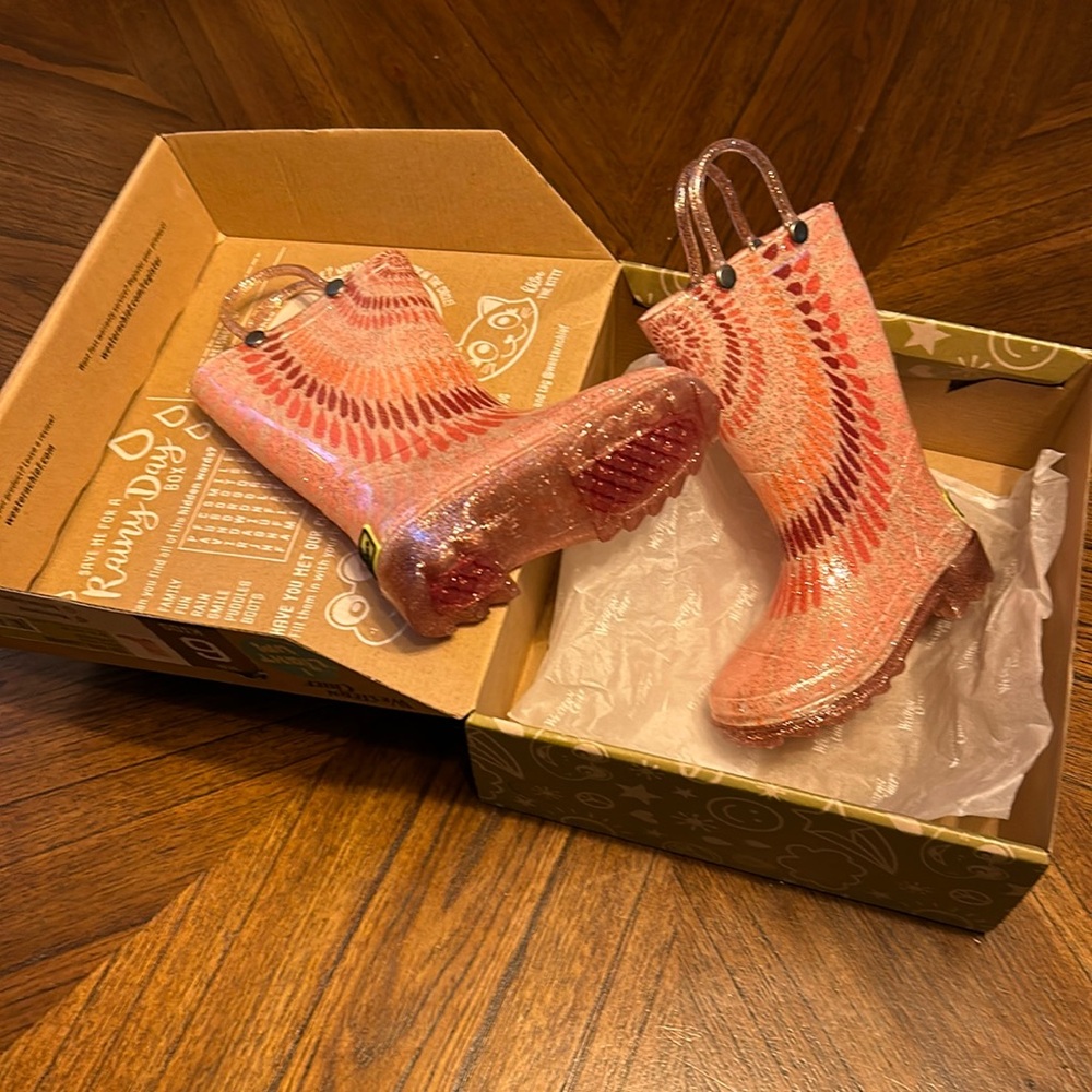 Rain boots. Never worn. In box.